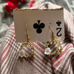 Gold Floral Hoop Earrings with White Flower Accent